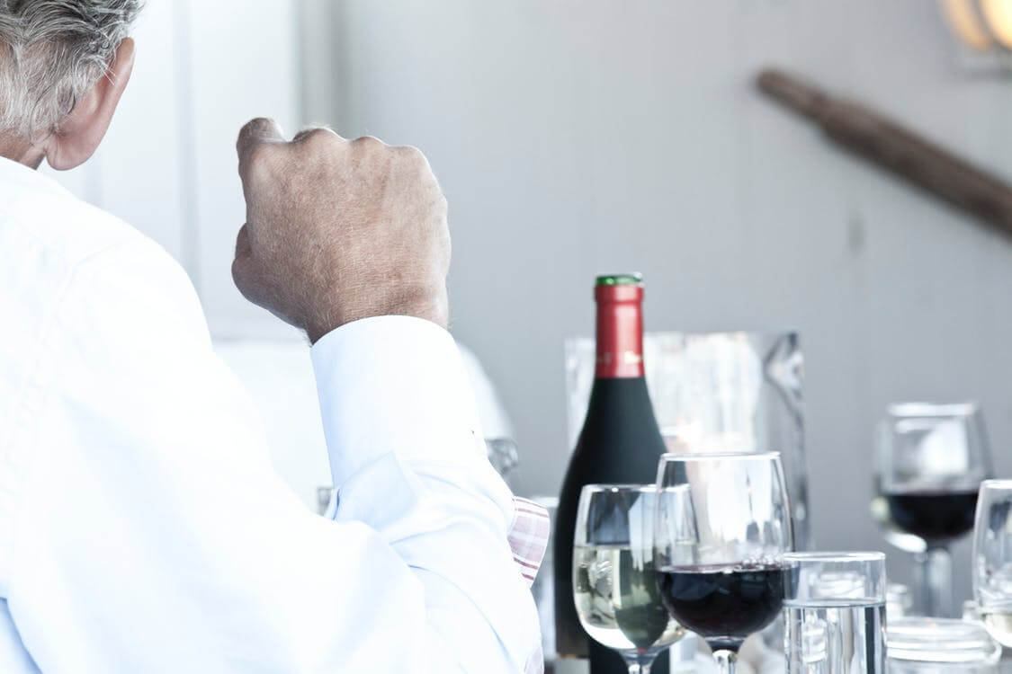 man drinking alcohol